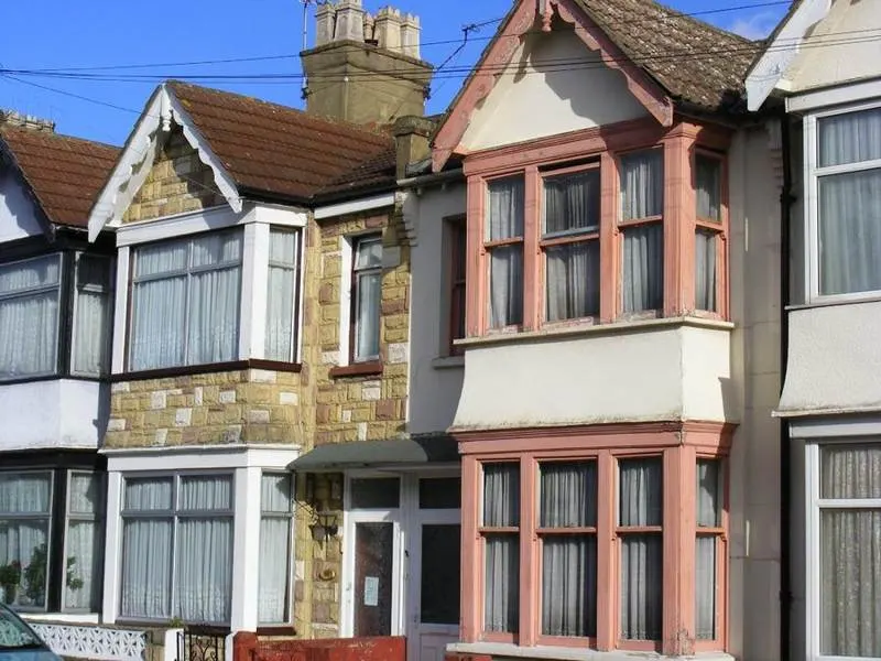 House front with stone cladding around the entrance