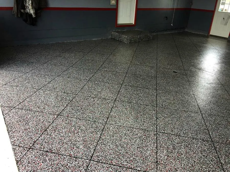 Grey speckled tiled floor with dark grout lines