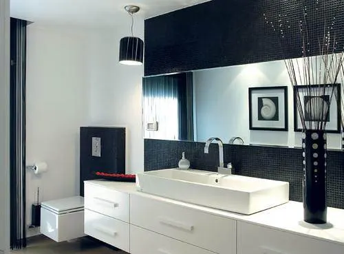 Bathroom with a white vanity against dark patterned walls