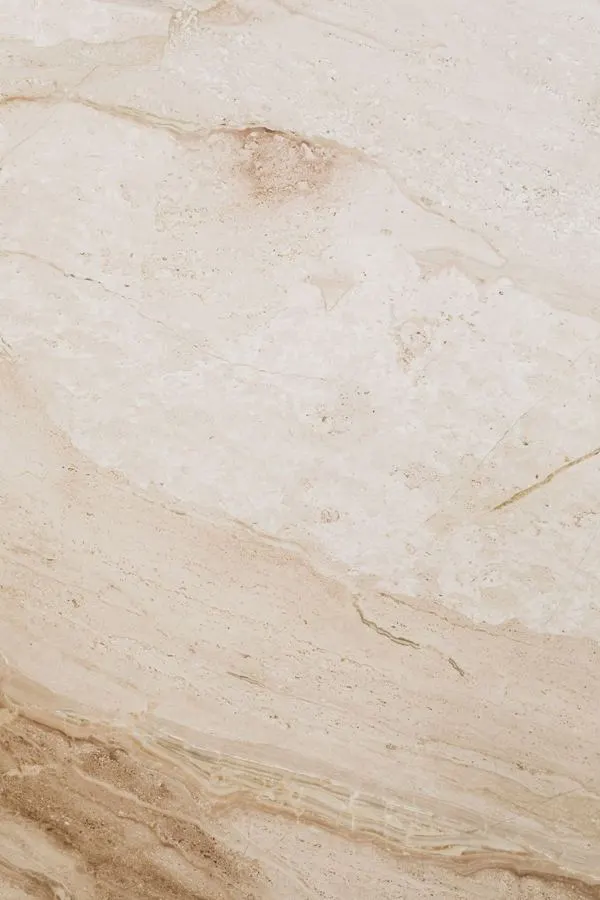 Beige stone surface with warm natural veining